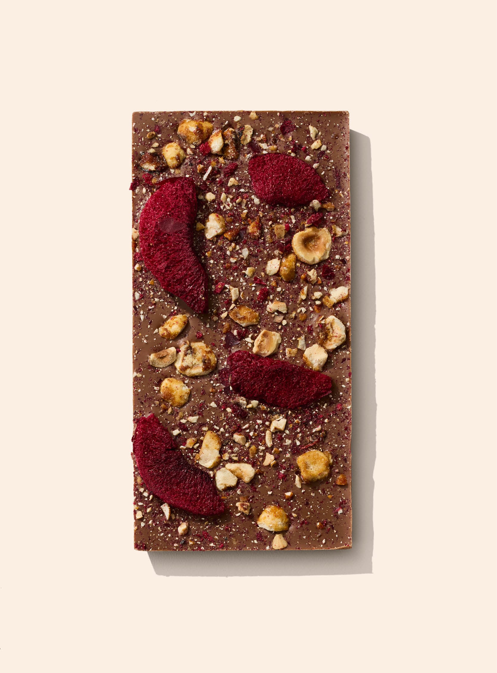New Zealand black doris plum and caramelised hazelnut pieces pressed into premium milk chocolate